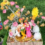 Radha Krishna statue  with artificial flowers and decorative