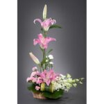 pink lilies and carnations and white orchids